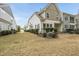 Exterior of home featuring landscaped yard and a covered patio offering ample space for outdoor enjoyment at 111 Wards Ridge Dr, Cary, NC 27513