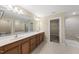 Large bathroom features a double sink vanity and separate tub and shower at 111 Wards Ridge Dr, Cary, NC 27513