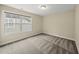 Neutral paint, plush carpeting and a sun-filled window create a cozy and inviting bedroom space at 111 Wards Ridge Dr, Cary, NC 27513