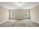 A spacious bedroom features carpet and two windows providing plenty of natural light at 111 Wards Ridge Dr, Cary, NC 27513
