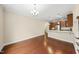 Bright dining area with hardwood floors and adjacent kitchen with granite countertops at 111 Wards Ridge Dr, Cary, NC 27513