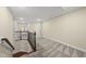 Upstairs hallway with carpet and views to other living spaces at 111 Wards Ridge Dr, Cary, NC 27513