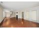 Open-concept living room showcasing hardwood floors, fireplace, staircase and access to outdoor patio at 111 Wards Ridge Dr, Cary, NC 27513