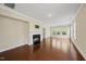 Spacious living room with fireplace, hardwood floors, and multiple windows for natural light at 111 Wards Ridge Dr, Cary, NC 27513
