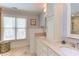 Bathroom with double sinks, granite countertops, and decorative tiling at 1159 Belfair Way, Chapel Hill, NC 27517