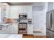 Modern kitchen with white cabinets, stainless steel appliances, and beautiful countertops at 1159 Belfair Way, Chapel Hill, NC 27517