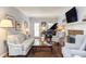 Elegant living room featuring a grand piano, fireplace, and stylish furnishings at 1159 Belfair Way, Chapel Hill, NC 27517