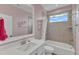 Bright bathroom with flamingo themed decor, featuring a white vanity and shower-tub combination at 1160 Duke Farm Dr, Wake Forest, NC 27587