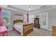 Charming bedroom with pink accents, featuring a cozy bed and ample natural light from the window at 1160 Duke Farm Dr, Wake Forest, NC 27587