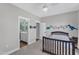 A delightful bedroom featuring a dark wood frame, a ceiling fan, an en suite bathroom, and wall decorations at 1160 Duke Farm Dr, Wake Forest, NC 27587
