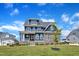 Charming exterior features stone accents, covered porch, and well-maintained lawn at 1160 Duke Farm Dr, Wake Forest, NC 27587