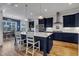 Modern kitchen with dark blue cabinets, an island, and stainless steel appliances at 1160 Duke Farm Dr, Wake Forest, NC 27587