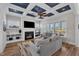 Bright living room featuring a fireplace, built-in shelving, and large windows at 1160 Duke Farm Dr, Wake Forest, NC 27587