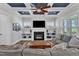 Well-lit living room with built-in shelving, a fireplace, and stylish decor at 1160 Duke Farm Dr, Wake Forest, NC 27587