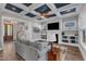 Inviting living room with coffered ceilings, fireplace, built-in shelves, and view of the front foyer at 1160 Duke Farm Dr, Wake Forest, NC 27587