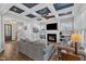 Cozy living room with a fireplace, built-in shelving, and hardwood flooring at 1160 Duke Farm Dr, Wake Forest, NC 27587