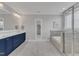 Main bathroom featuring double vanity, soaking tub, and glass shower at 1160 Duke Farm Dr, Wake Forest, NC 27587