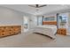 Large main bedroom with a ceiling fan, wood furniture, and ensuite access at 1160 Duke Farm Dr, Wake Forest, NC 27587