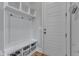 Bright mudroom with coat hooks and shelving, perfect for organization at 1160 Duke Farm Dr, Wake Forest, NC 27587