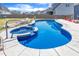 Backyard pool with a stone waterfall feature, and stamped concrete surround at 1160 Duke Farm Dr, Wake Forest, NC 27587