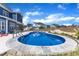 Backyard in-ground pool with stamped concrete edge and surrounding fence offers privacy and a spot to relax at 1160 Duke Farm Dr, Wake Forest, NC 27587