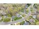 Wide aerial shot of the community, complete with green spaces, winding streets, and various home styles at 124 Holly Ridge Ln, Mebane, NC 27302