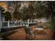 Inviting backyard with a fire pit, seating area, and a pool, perfect for outdoor entertaining at 124 Holly Ridge Ln, Mebane, NC 27302