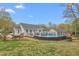Expansive backyard with pool, patio area, and a lush lawn, great for outdoor living at 124 Holly Ridge Ln, Mebane, NC 27302