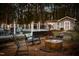 Secluded backyard featuring a fire pit, relaxing chairs and pool for enjoying the outdoors at 124 Holly Ridge Ln, Mebane, NC 27302