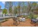 Outdoor patio space with pool, lounge area, and lush landscaping for outdoor activities at 124 Holly Ridge Ln, Mebane, NC 27302