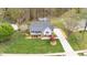 Charming home featuring a covered front porch, manicured lawn, and a well-maintained driveway at 124 Holly Ridge Ln, Mebane, NC 27302