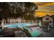 Outdoor pool with deck and lounge chairs perfect for relaxation on summer evenings at 124 Holly Ridge Ln, Mebane, NC 27302