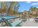 Inviting backyard pool area with lounge chairs and patio furniture for entertaining guests at 124 Holly Ridge Ln, Mebane, NC 27302