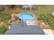 Aerial view of backyard pool and deck area with outdoor seating, creating a relaxing outdoor oasis at 124 Holly Ridge Ln, Mebane, NC 27302