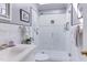 Modern bathroom with sleek vanity, glass-enclosed shower, and white tile surround at 125 Long Shadow Pl, Durham, NC 27713