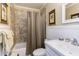 Bathroom with a shower-tub combo, gold framed art, and stylish vanity at 125 Long Shadow Pl, Durham, NC 27713