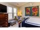 Bedroom featuring large windows, wood furniture, and bright natural light at 125 Long Shadow Pl, Durham, NC 27713
