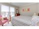 Cozy bedroom with two windows, a patterned chair, and comfortable bed at 125 Long Shadow Pl, Durham, NC 27713