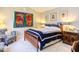 Comfortable bedroom with a wooden bed frame, patterned bedding, and curated wall decor at 125 Long Shadow Pl, Durham, NC 27713
