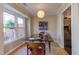 Inviting dining room with warm lighting and a view to outside through a large window at 125 Long Shadow Pl, Durham, NC 27713