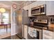 Modern kitchen with stainless steel appliances, granite countertops, and decorative wall art at 125 Long Shadow Pl, Durham, NC 27713
