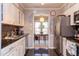 Bright kitchen featuring a stainless steel refrigerator and a view into the dining room at 125 Long Shadow Pl, Durham, NC 27713