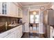 Well-lit kitchen with sleek appliances and a clear view into the adjacent dining space at 125 Long Shadow Pl, Durham, NC 27713
