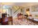 Spacious living room with hardwood floors, fireplace, and staircase at 125 Long Shadow Pl, Durham, NC 27713