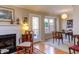 Living room with fireplace and access to the balcony and dining room at 125 Long Shadow Pl, Durham, NC 27713
