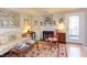 Cozy living room with a fireplace and access to the outdoor balcony at 125 Long Shadow Pl, Durham, NC 27713