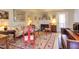 Cozy living room with a fireplace, piano and access to the outdoor balcony at 125 Long Shadow Pl, Durham, NC 27713