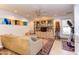 The living room offers a cozy space with a large built-in bookcase, comfortable seating, and natural light at 125 Long Shadow Pl, Durham, NC 27713