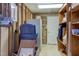 Unfinished basement storage space, with exposed studs, wooden shelves, and a variety of stored items at 125 Long Shadow Pl, Durham, NC 27713