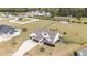 Charming two-story home boasts an attached two car garage and long driveway, nestled on a sizable lot at 127 Hurricane Aly, Benson, NC 27504